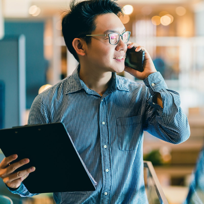 Photo of a man talking on the phone