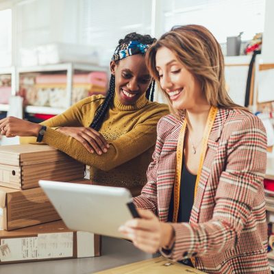 Photo Of A Two Woman Using A Tablet