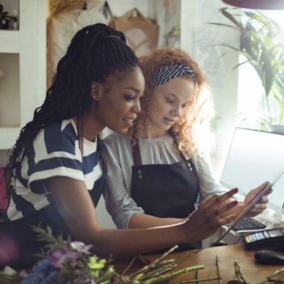 Picture Of Two Women Using A Tablet