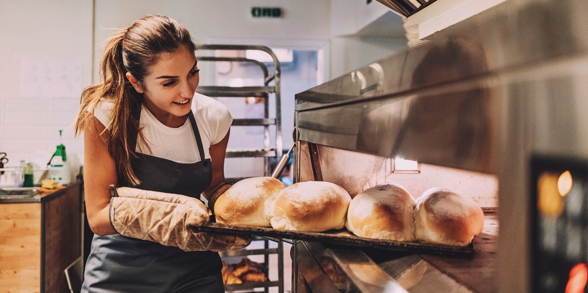 a person cooking food in a kitchen