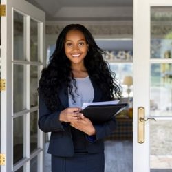 A Woman Standing In Front Of A Building